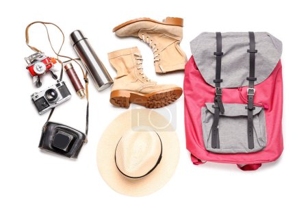 Photo for Set of traveler accessories with backpack, thermos and photo camera on white background - Royalty Free Image