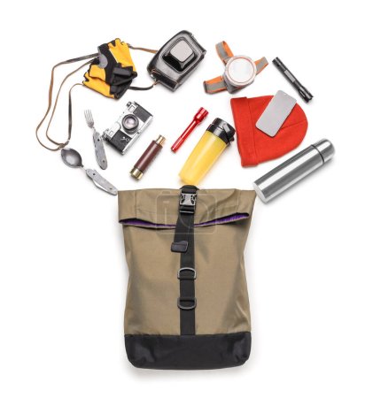 Photo for Set of hiking essentials with backpack and outdoor gear on white background - Royalty Free Image