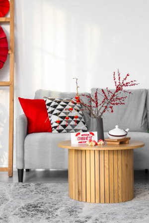 Photo for Interior of living room with sofa, table and decor for Chinese New Year celebration - Royalty Free Image