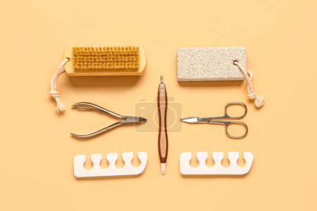 Photo for Set of professional tools for pedicure on orange background - Royalty Free Image