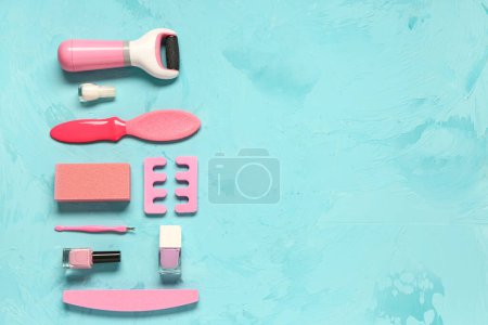 Photo for Set of professional tools for pedicure with nail polishes on grunge blue background - Royalty Free Image