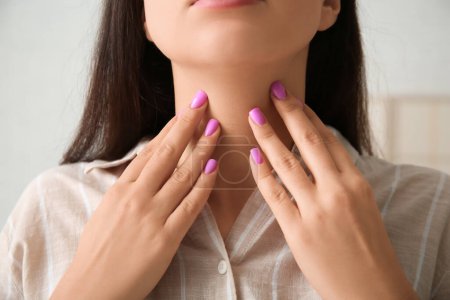 Photo for Young woman with thyroid gland problem at home, closeup - Royalty Free Image