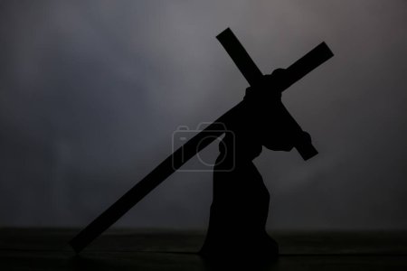 Photo for Jesus carrying wooden cross on grey background. Good Friday concept - Royalty Free Image