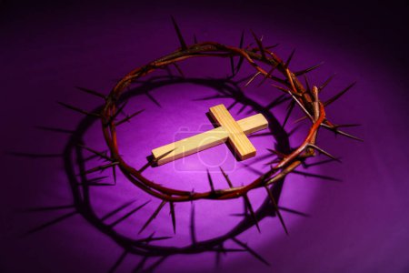 Photo for Wooden cross with crown of thorns on purple background. Good Friday concept - Royalty Free Image