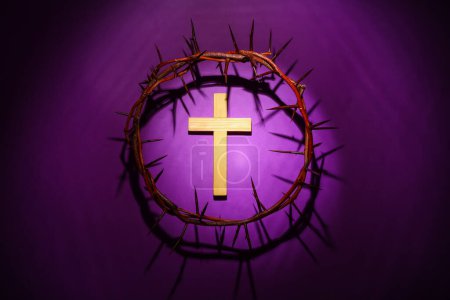Photo for Wooden cross with crown of thorns on purple background. Good Friday concept - Royalty Free Image
