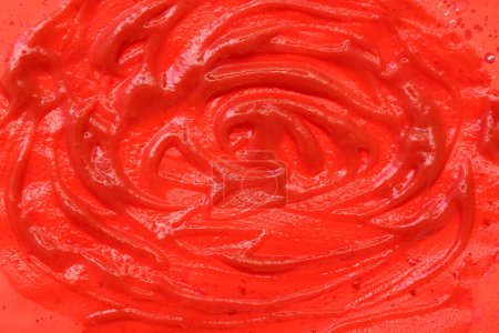 Photo for Closeup view of tomato sauce smears on red background - Royalty Free Image