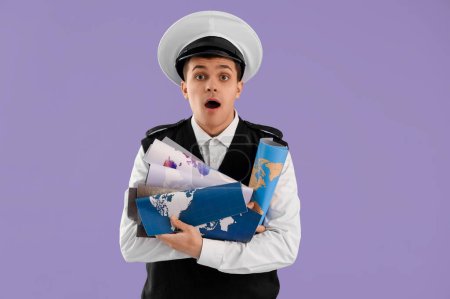Shocked young sailor with world maps on lilac background