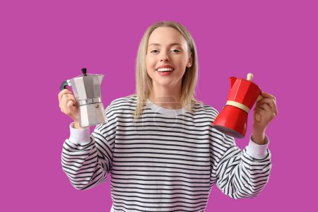 Photo for Pretty young woman with geyser coffee makers on purple background - Royalty Free Image