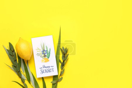 Four species (lulav, hadas, arava, etrog) and greeting card with text HAPPY SUKKOT on yellow background