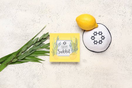 Four species (lulav, hadas, arava, etrog) and greeting card with text HAPPY SUKKOT on white grunge background