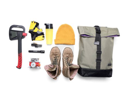 Photo for Set of hiking essentials with backpack, boots and outdoor gear on white background - Royalty Free Image