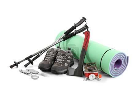 Photo for Set of camping equipment with trekking piles, hatchet and portable stove on white background - Royalty Free Image