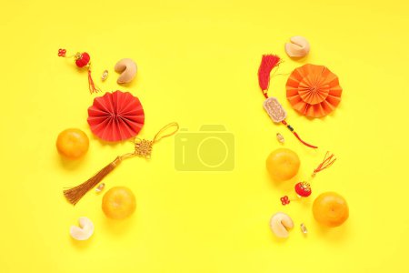 Photo for Fortune cookies with mandarins and Chinese symbols on yellow background. New Year celebration - Royalty Free Image