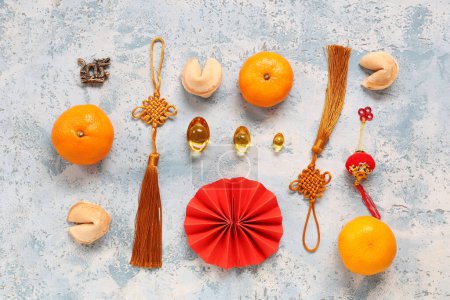 Photo for Mandarins with fortune cookies and Chinese symbols on blue grunge background. New Year celebration - Royalty Free Image