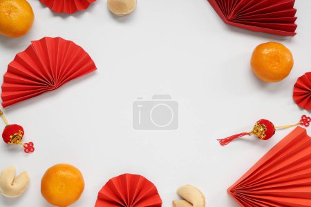 Photo for Frame made of fortune cookies with mandarins and Chinese symbols on white background. New Year celebration - Royalty Free Image