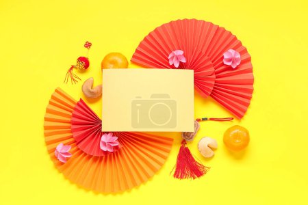 Photo for Blank card with Chinese symbols, tangerines and fortune cookies on yellow background. New Year celebration - Royalty Free Image