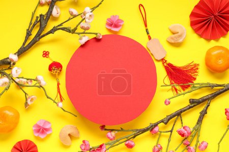 Photo for Blank card with Chinese symbols, branches of flowers and fortune cookies on yellow background. New Year celebration - Royalty Free Image