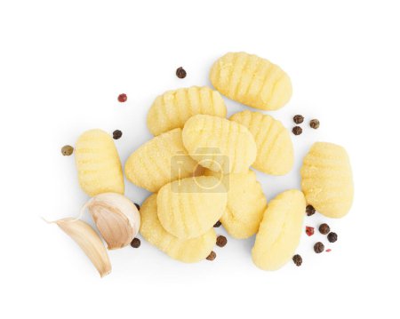 Tasty gnocchi with garlic and peppercorn on white background