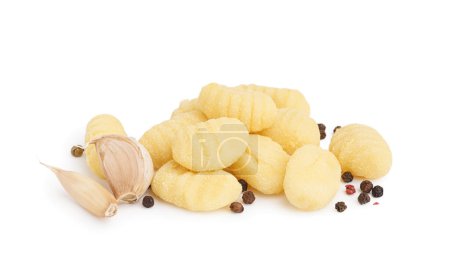 Tasty gnocchi with garlic and peppercorn on white background
