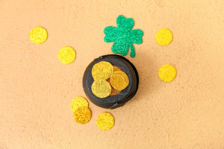 Photo for Leprechaun pot with golden coins and clover leaf on beige background. St. Patrick's Day celebration - Royalty Free Image