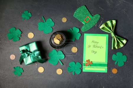 Photo for Leprechaun pot with golden coins, clover leaves and gift box on black background. St. Patrick's Day celebration - Royalty Free Image