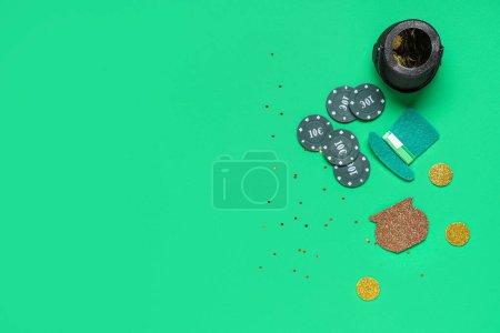 Poker chips, pot with coins and leprechaun's hat on green background. St. Patrick's Day celebration