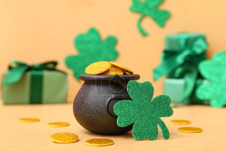 Photo for Leprechaun pot with golden coins and clover leaf on beige background. St. Patrick's Day celebration - Royalty Free Image