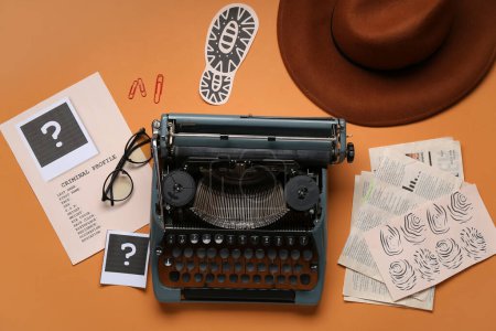 Retro typewriter, criminal files, eyeglasses and hat on color background