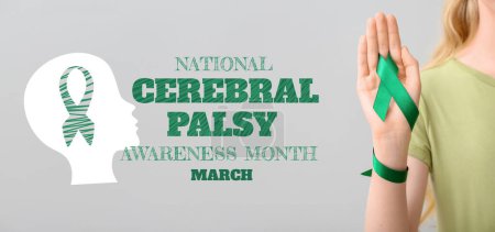 Photo for Banner for National Cerebral Palsy Awareness Month with woman holding green ribbon - Royalty Free Image