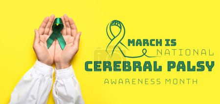 Photo for Banner for National Cerebral Palsy Awareness Month with hands holding green ribbon - Royalty Free Image