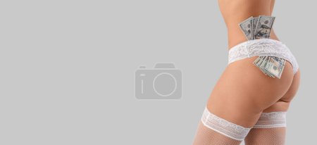 Photo for Young prostitute with money on light background with space for text - Royalty Free Image