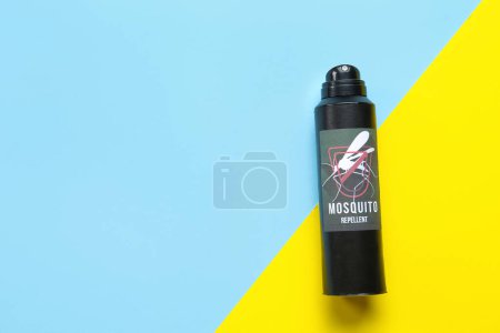 Mosquito repellent spray on color background