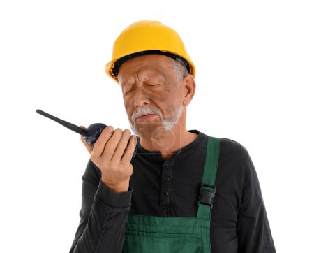 Mature miner man with two-way radio on white background