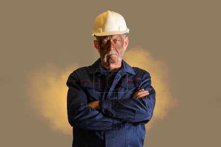 Mature miner man on color background