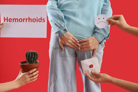 Mature woman and hands with things on red background. Hemorrhoids concept