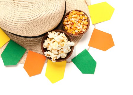 Bowls of corn with straw hat and flags on white background. Festa Junina (June Festival) celebration