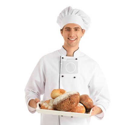Photo for Handsome young chef holding tray with fresh bread on white background - Royalty Free Image