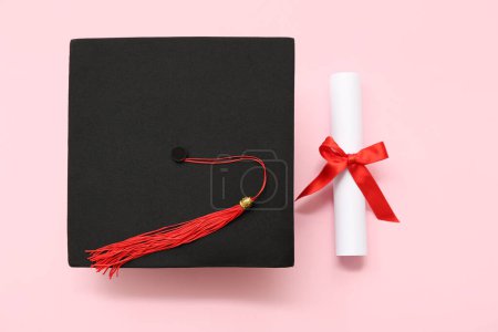 Photo for Graduation hat and diploma on pink background - Royalty Free Image