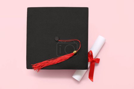 Photo for Graduation hat and diploma on pink background - Royalty Free Image