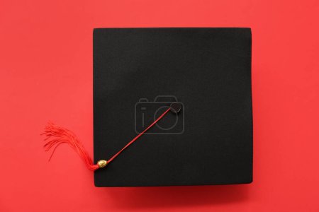 Photo for Graduation hat on red background - Royalty Free Image