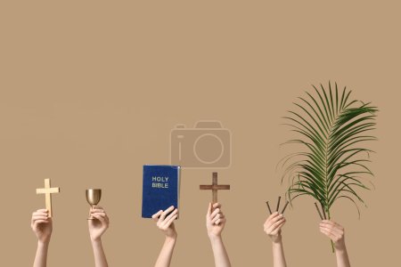 Photo for Female hands with Holy Bible, wooden crosses, nails and palm leaf on color background. Good Friday concept - Royalty Free Image