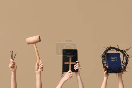 Photo for Female hands with Holy Bibles, nails and crown of thorns on color background. Good Friday concept - Royalty Free Image