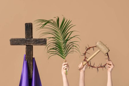 Photo for Female hands with wooden cross, palm leaf, wooden mallet and and crown of thorns on color background. Good Friday concept - Royalty Free Image