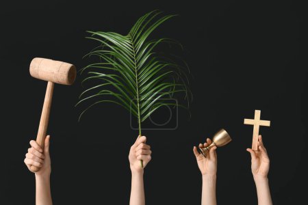 Photo for Female hands with wooden mallet, palm leaf, cup and cross on dark background. Good Friday concept - Royalty Free Image