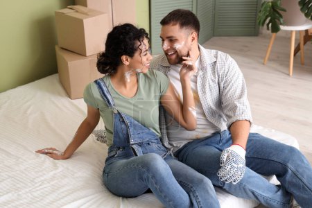 Photo for Beautiful young couple resting while doing repair in their new house - Royalty Free Image