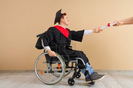 Male graduate in wheelchair receiving diploma near beige wall