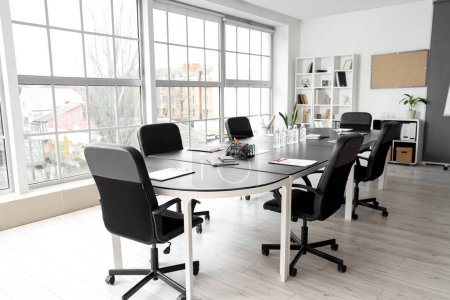 Interior of office with table prepared for meeting