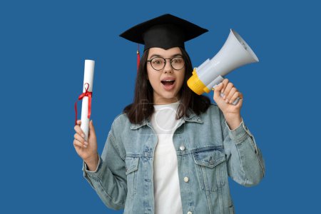 Photo for Female student in graduation hat with diploma and megaphone on blue background - Royalty Free Image