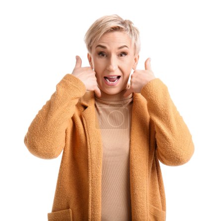 Emotional mature woman showing "call me" gesture on white background