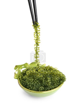 Chopsticks with healthy seaweed on white background